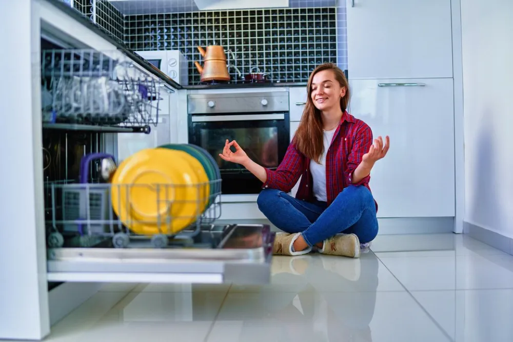 A thankful woman after repairing LG dishwasher