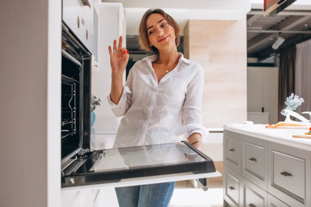 Satisfied woman with Electrolux oven