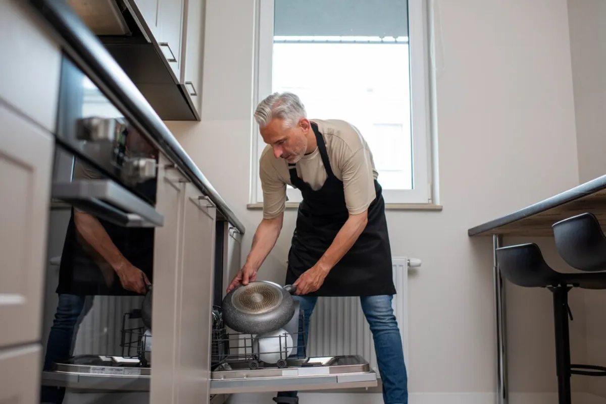 A man using Maytag dishwasher in Ottawa