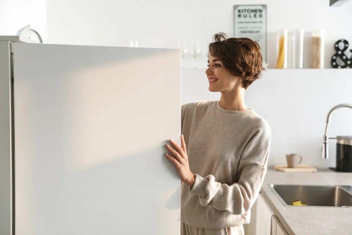 A woman happy with Maytag fridge